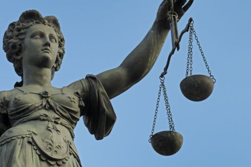 lady-justice-blind-to-corruption-scales-statue.jpg